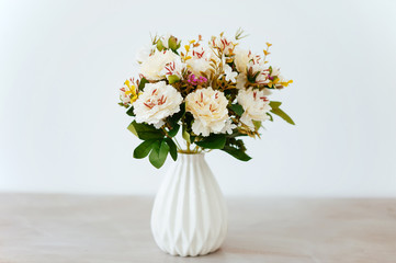 bouquet in a vase light background