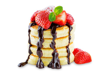 pancakes with sauce, berries and mint leaf