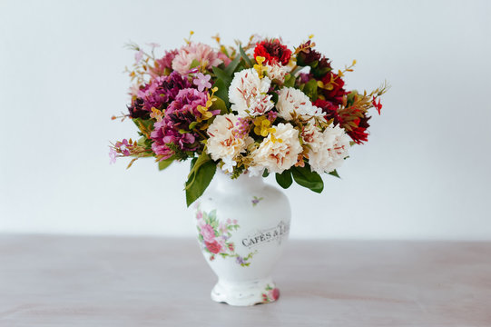 bouquet in a vase light background