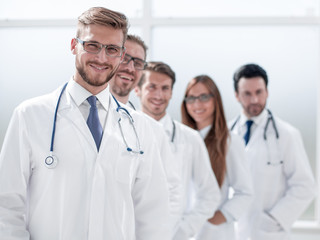 team of doctors standing in the hospital corridor