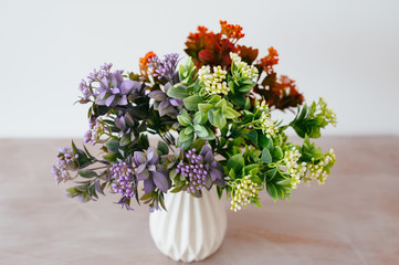 bouquet in a vase light background