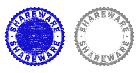 Grunge SHAREWARE stamp seals isolated on a white background. Rosette seals with grunge texture in blue and grey colors. Vector rubber stamp imitation of SHAREWARE text inside round rosette.