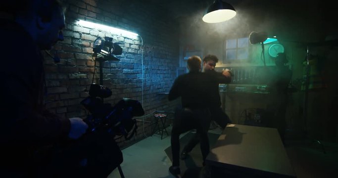 Actors shooting fighting scene