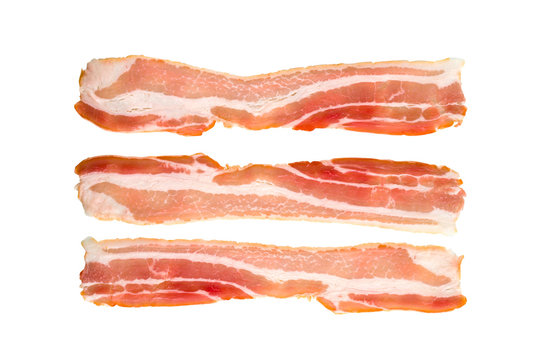 A slice of bacon on a white background. Three raw bacon close up on a white background.