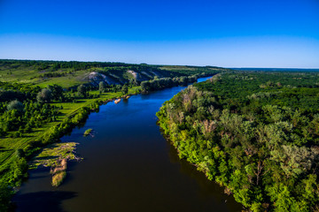 river flowing in the beautiful valley. Aerial view landscape. shooting from a drone. Summer time