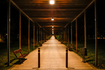 symmetrical porch after rain at night in a street park