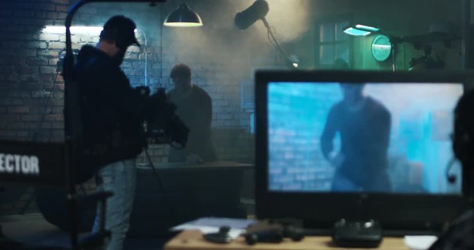 Actors shooting take of fight scene