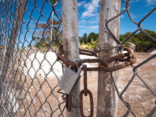 Door lock on metal gate with chain