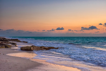 Sunset on the Caribbean Sea. Clear sky with small clouds.