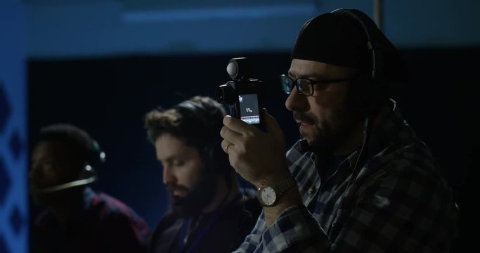 Young director giving instructions on a film set