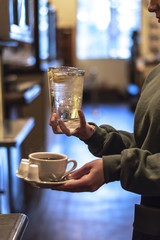 waitress serving coffee