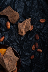 diffrent kind of chocolate with natural cocao beans at black background