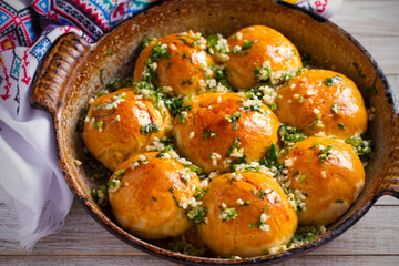 Garlic bread, buns. Bread rolls with garlic and parsley. horizontal