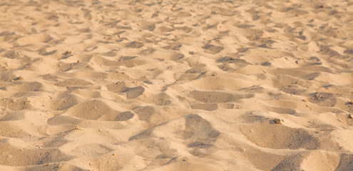 Closeup of sand pattern of a beach in the summer. Background.concept for summer season