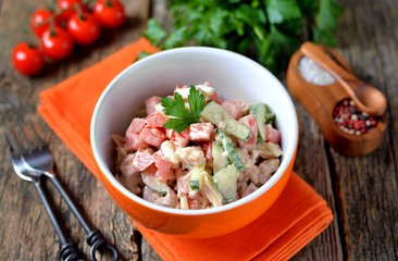 Fresh cucumber and tomato salad with smoked chicken, cheese and yogurt.