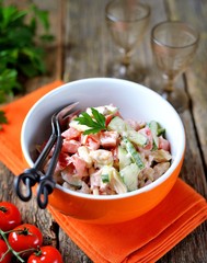Fresh cucumber and tomato salad with smoked chicken, cheese and yogurt.