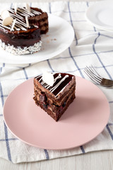 Piece of chocolate cherry cake, low angle view. Close-up.