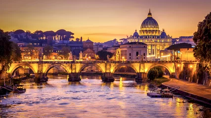 Poster The dome of Saint Peters Basilica and Vatican City at sunset. Sant'Angelo Bridge over the Tiber River. Rome, Italy © CrackerClips