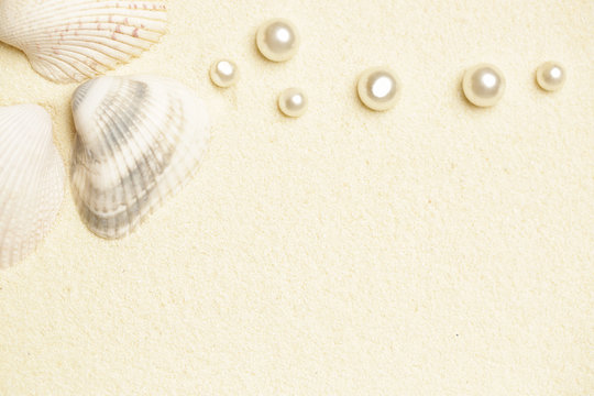 White beach sand, shells and pearls