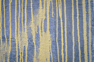 Grunge conrete background with yellow paint stripes