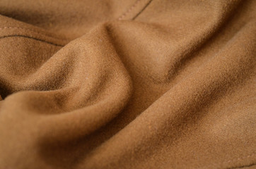 Wrinkled brown woolen fabric for background