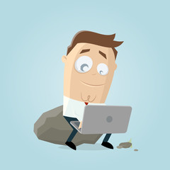 funny businessman sitting on a rock and working on notebook