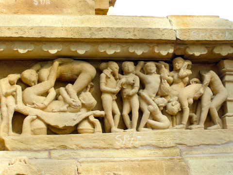 Fragment of ancient bas-relief at famous erotic temple in Khajuraho, India