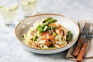 Italian risotto with shrimps, mushrooms, asparagus and parmesan. Healthy food.