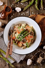 Italian risotto with shrimps, mushrooms, asparagus and parmesan. Healthy food.
