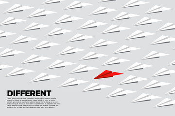 red origami paper airplane in group of white. Business Concept of think different and vision mission.