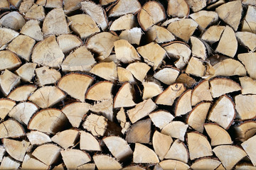 The firewood combined in two ranks for a furnace kindling. Firewood combined in a woodpile. Chopped...