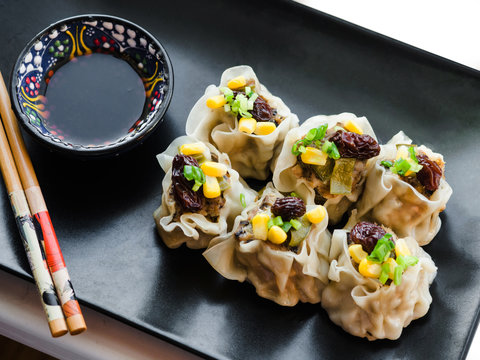 Shaomai is a type of traditional Chinese dumpling, Cantonese cuisine, consists of chopped or minced mutton, scallion and ginger (or Dim sum)