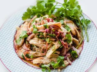 'Yum Hed' or 'Larb Hed' Thai Style Spicy and sour Mushroom Salad with vegetables