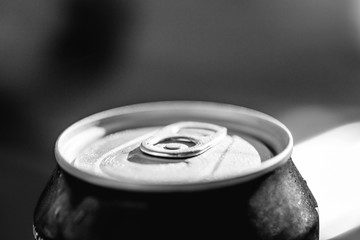 Close-up view of the top of a can drink with condensation.