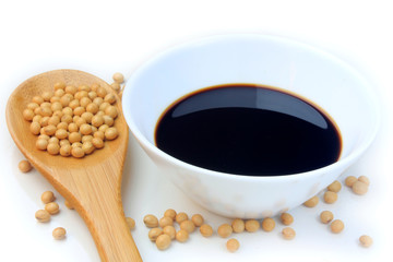 Soya beans with dark soy sauce in a ceramic bowl isolated over white background. Copy Space