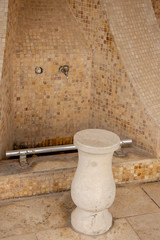 The tap and chair for taking ablution