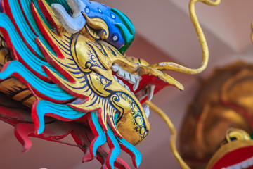 Colorful dragon sculpture at the entrance stair in Chinese temple