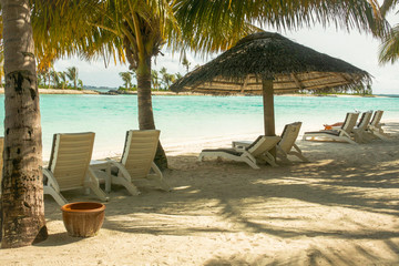 Beautiful tropical Maldives island with white sandy beach and sea in  sunshine  day for holiday ,summer, vacation .