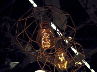 Luxury and urban design round glowing light bulbs lamp with blurry background.