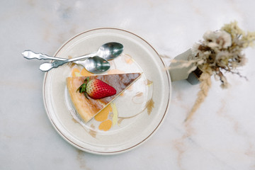 Cheesecake strawberry  with fresh berries on plate, table background in cafe shop
