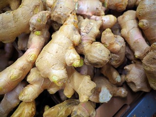 Fresh organic ginger at fresh market, Close-up heap of ginger root background