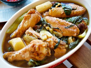 Tom Jab Chai stew in Chinese, Mixed of vegetables soup, tofu, Thai famous cuisine with chicken wings.