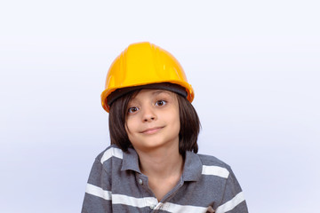 Little boy with construction helmet.