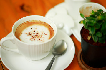 cup of coffee on the wooden