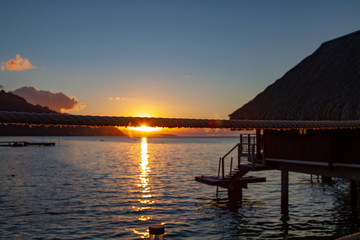 Fototapeta na wymiar Beautiful sunset from walk way of over the water bungalows