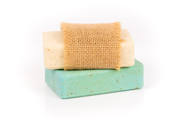 green and beige homemade herbal soap bars