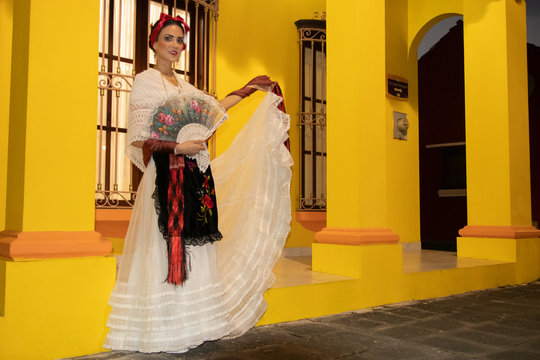 jarocha with yellow colonial background,