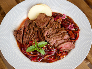 Kangaroo meat steak with raspberry sauce