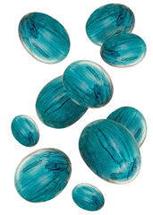 Falling blue colored chicken eggs of different size isolated on white background