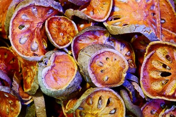Close up dried herb. Dried bael fruit background. Many of slices of bael fruit.